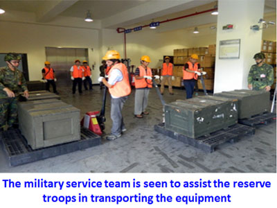 The military service team is seen to assist the reserve troops in transporting the equipment