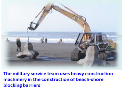 The military service team uses heavy construction machinery in the construction of beach-shore blocking barriers